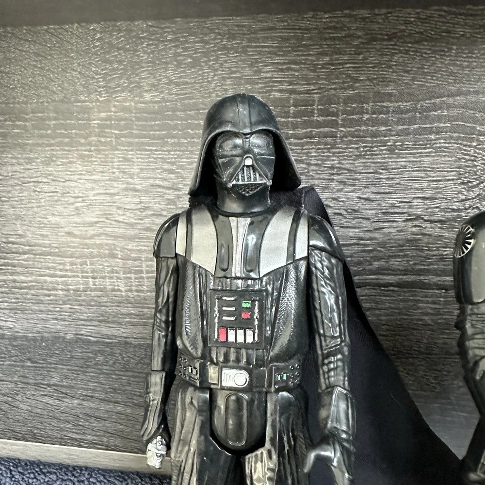 Star Wars action‎ figures Darth Vader, a TIE Fighter Pilot, Kylo Ren, and Finn